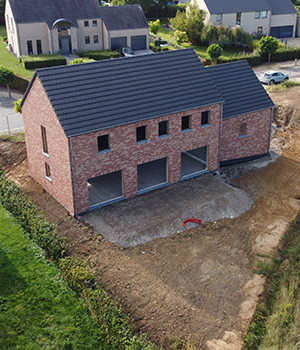 Réalisation clé sur porte d'une maison neuve personnalisée par l'équipe experte de Piron Construction