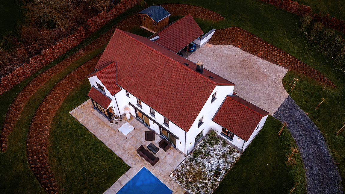 Maison contemporaine en L avec orientation sud et espace modulable