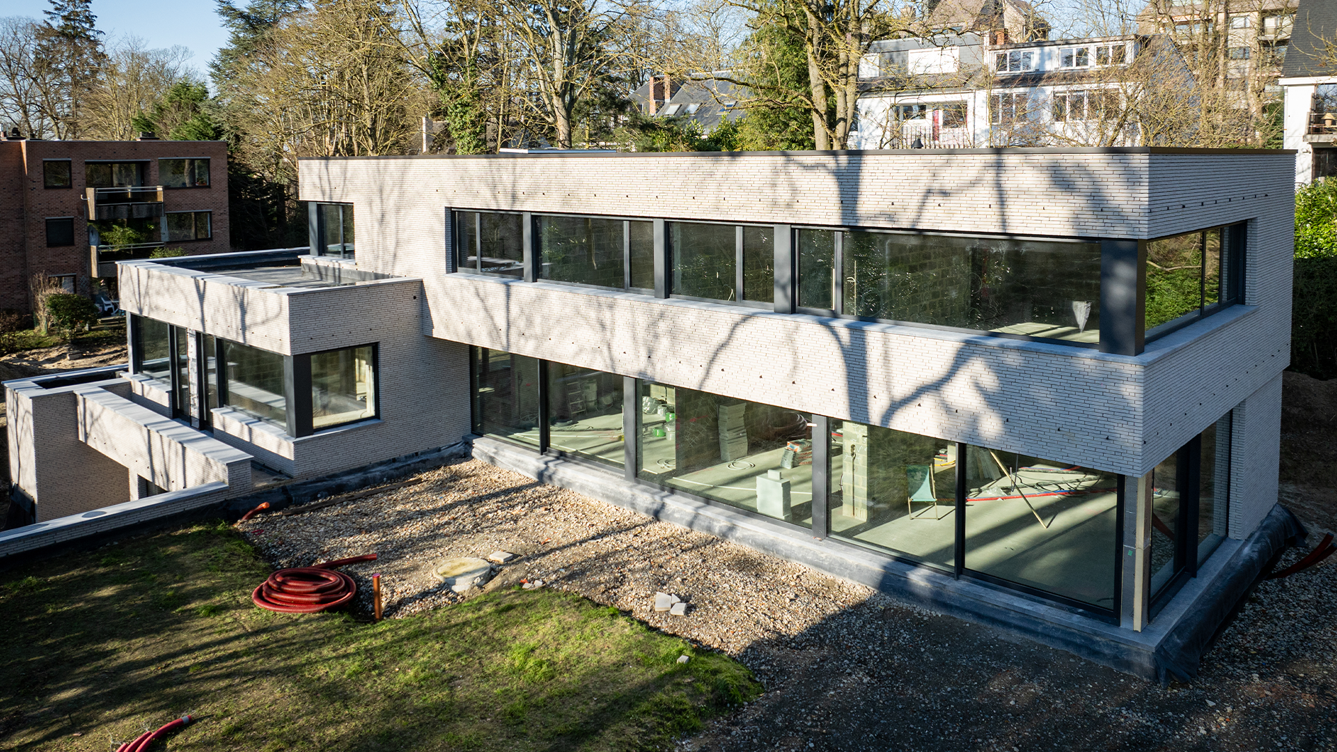 Belle maison haut de gamme avec grandes baies vitrées construite par un constructeur spécialisé en Belgique